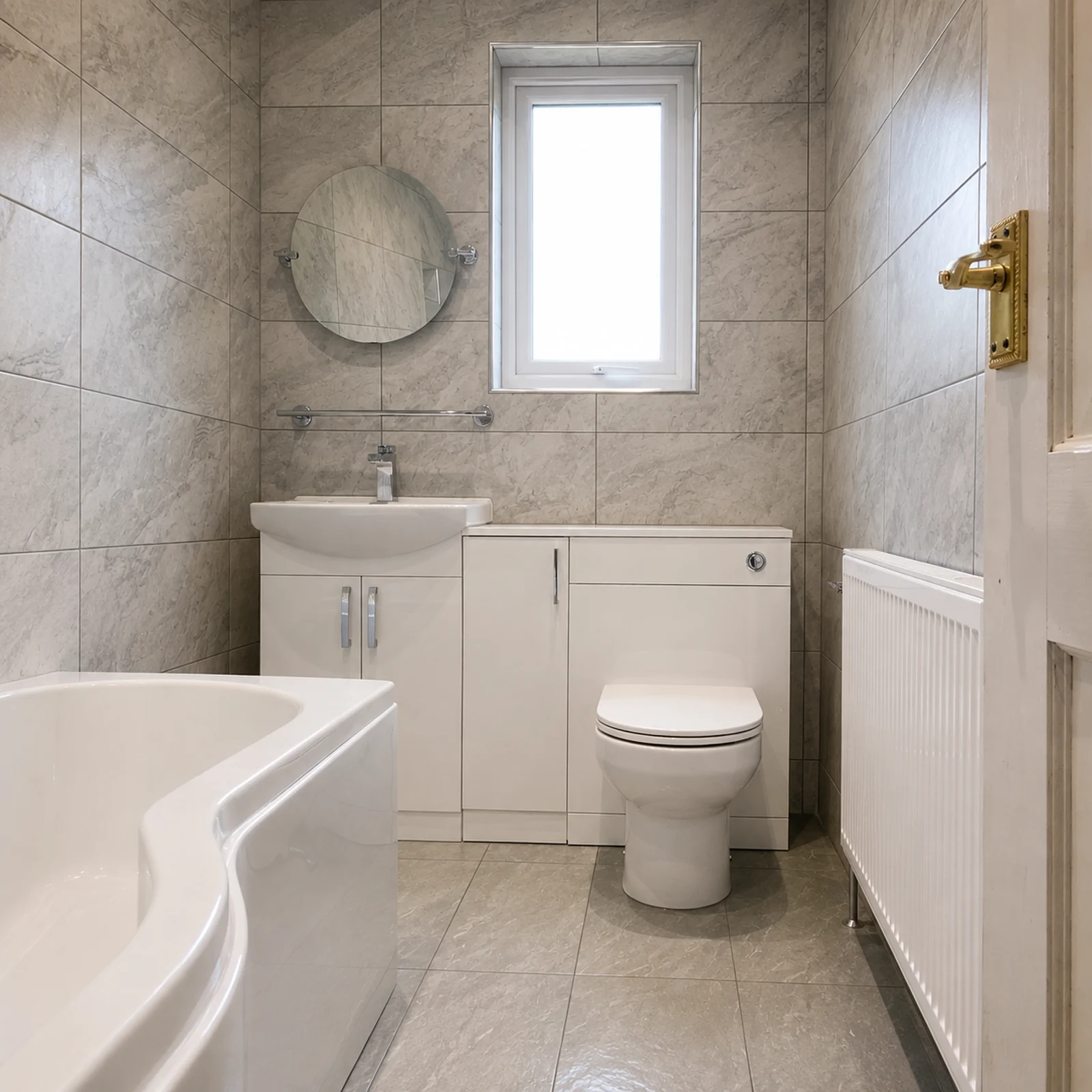 Finished tiled family bathroom with fitted bath, vanity and toilet