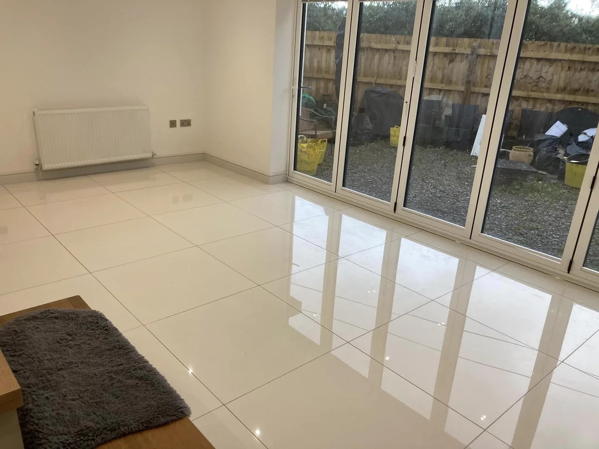 Completed polished tile flooring and patio doors