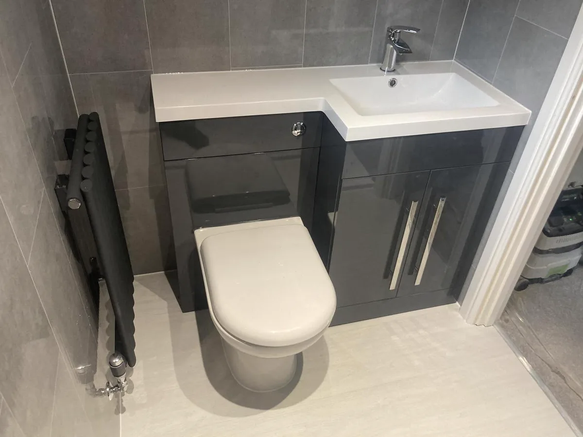 Compact cloakroom with fitted vanity unit