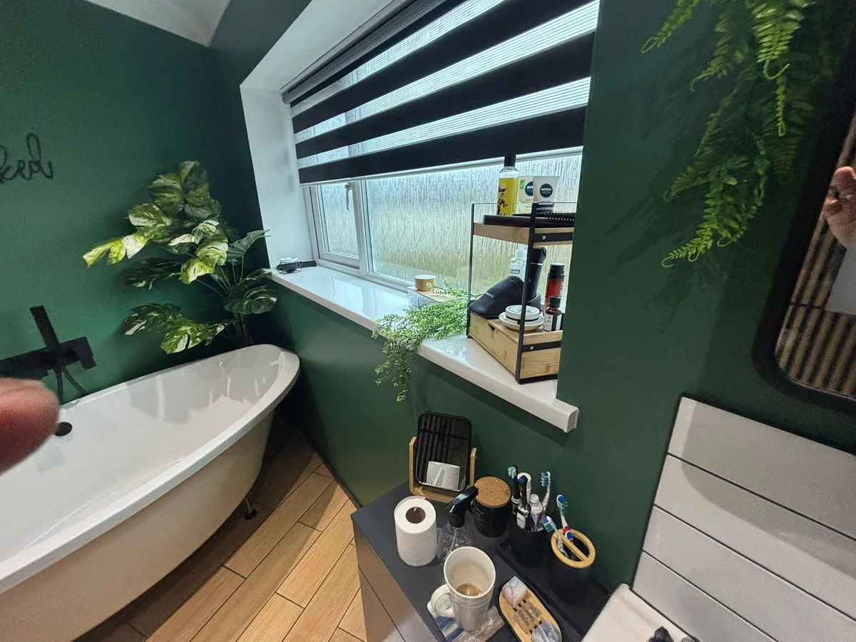 Contemporary green bathroom with bath and vanity
